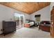 Bedroom with balcony access, carpeted floors and great natural light at 11724 Little Turtle Ln, Conifer, CO 80433