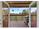 View from home to outdoor deck featuring wood railing and barbecue at 11724 Little Turtle Ln, Conifer, CO 80433