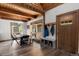 Open-concept dining area with hardwood floors, views of the outdoors, and ample natural light at 11724 Little Turtle Ln, Conifer, CO 80433