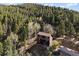 Two-story cabin with a balcony and wooded lot in a serene mountain setting at 11724 Little Turtle Ln, Conifer, CO 80433
