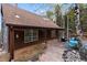 A beautiful stone patio with ample seating and lighting, perfect for outdoor enjoyment at 11724 Little Turtle Ln, Conifer, CO 80433