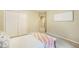 Neutral bedroom features a double closet and a blanket chest at the end of the bed at 10 Long Bow Cir, Monument, CO 80132