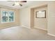 Cozy room with ceiling fan, large window, adjacent bonus nook and neutral decor at 10 Long Bow Cir, Monument, CO 80132