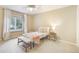 Comfortable bedroom with a large window and neutral decor at 10 Long Bow Cir, Monument, CO 80132