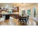 Open dining area features hardwood floors and views of the well-manicured backyard at 10 Long Bow Cir, Monument, CO 80132