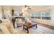 Open floor plan living room with natural lighting and hardwood flooring throughout at 10 Long Bow Cir, Monument, CO 80132