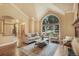 Comfortable living room boasting a vaulted ceiling, a large window, and neutral decor creating a serene ambiance at 10 Long Bow Cir, Monument, CO 80132