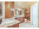 Large main bathroom with a granite vanity, tiled floors, and glass enclosed shower at 10 Long Bow Cir, Monument, CO 80132