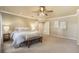 Spacious main bedroom features soft carpeting, a ceiling fan, and tranquil atmosphere at 10 Long Bow Cir, Monument, CO 80132