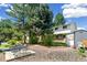 Backyard featuring a combination of lawn, gravel, mature trees and storage shed at 7970 S Cook Way, Centennial, CO 80122