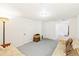 Spacious basement with two futons and carpeted floors at 7970 S Cook Way, Centennial, CO 80122