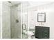 Modern bathroom with sleek glass shower, marble tiles, updated vanity, and stylish fixtures at 7970 S Cook Way, Centennial, CO 80122