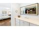 Bathroom vanity with quartz countertop with access to bedroom and closet at 7970 S Cook Way, Centennial, CO 80122