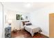 Bedroom with wood floors, window, and twin bed at 7970 S Cook Way, Centennial, CO 80122