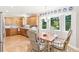 Dining area with natural light and views of the outside, connected to the kitchen at 7970 S Cook Way, Centennial, CO 80122