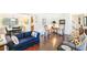 Comfortable living room with hardwood floors, sitting furniture, and bright natural light at 7970 S Cook Way, Centennial, CO 80122