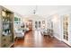 Bright living room with high ceilings, hardwood floors and French doors at 7970 S Cook Way, Centennial, CO 80122