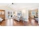 Spacious living room with hardwood floors, vaulted ceiling, and French doors at 7970 S Cook Way, Centennial, CO 80122