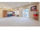 Basement featuring plush carpeting, recessed lighting, and sliding glass doors leading to the exterior at 860 Bramblewood Dr, Castle Pines, CO 80108
