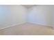 Empty bedroom features neutral carpet, light walls, and natural lighting at 860 Bramblewood Dr, Castle Pines, CO 80108