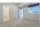 Carpeted bedroom with a closet and a large window at 860 Bramblewood Dr, Castle Pines, CO 80108