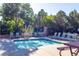Inviting community pool with ample seating and lush landscaping for a resort-like feel at 860 Bramblewood Dr, Castle Pines, CO 80108