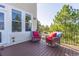 Relaxing outdoor deck area with comfortable seating and views of the surrounding landscape at 860 Bramblewood Dr, Castle Pines, CO 80108