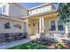 Inviting front porch with comfortable seating and decorative accents for relaxing outdoor enjoyment at 860 Bramblewood Dr, Castle Pines, CO 80108