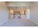 Open loft area showcasing the home's staircase and a view of the dining room at 860 Bramblewood Dr, Castle Pines, CO 80108