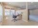 Bright office featuring carpet, large windows, and views to the back patio at 860 Bramblewood Dr, Castle Pines, CO 80108