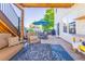 Outdoor patio with a lounge seating area, dining table, and access to the home at 860 Bramblewood Dr, Castle Pines, CO 80108
