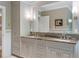 Bathroom with double vanity sinks, granite counters, and custom cabinets at 395 N Franklin St, Denver, CO 80218