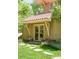 Back exterior view showcasing the manicured lawn, stone pathway, and French doors at 395 N Franklin St, Denver, CO 80218