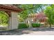 Exterior view of the property showcasing architecture, gated entrance and mature trees at 395 N Franklin St, Denver, CO 80218