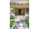 Inviting home front entrance with stone steps, elegant pillars, and a beautifully crafted door at 395 N Franklin St, Denver, CO 80218