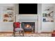 Cozy living room with a fireplace, TV, bookshelves, and a decorative rug at 395 N Franklin St, Denver, CO 80218