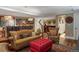 Cozy living room with comfortable seating, wood floors, area rug, and a partial view of basement bar area at 395 N Franklin St, Denver, CO 80218