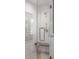 Modern shower with glass doors, tile walls, and a built-in bench at 395 N Franklin St, Denver, CO 80218
