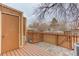 Backyard deck has privacy fence, gate, brick pavers, and an included storage shed at 11973 E Kepner Dr, Aurora, CO 80012