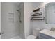 This bathroom has a shower, toilet, sink and shelves at 11973 E Kepner Dr, Aurora, CO 80012