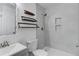 This bathroom has a modern shower and floating shelves at 11973 E Kepner Dr, Aurora, CO 80012
