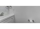 This bathroom has a sleek sink, mirror, and toilet paper holder at 11973 E Kepner Dr, Aurora, CO 80012