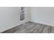 Bedroom featuring stylish gray floors and a window at 11973 E Kepner Dr, Aurora, CO 80012