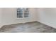 Bedroom featuring stylish gray floors and a large window at 11973 E Kepner Dr, Aurora, CO 80012