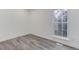 Bedroom featuring stylish gray floors and a window at 11973 E Kepner Dr, Aurora, CO 80012