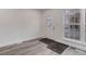Inviting entryway boasting modern gray floors, white walls, and a bright, welcoming ambiance at 11973 E Kepner Dr, Aurora, CO 80012