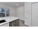 Kitchen featuring a stainless steel dishwasher, granite countertops and a view to the backyard at 11973 E Kepner Dr, Aurora, CO 80012