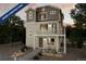 Two-story home with light-colored siding, multiple windows, and a balcony at 13518 E 103Rd Pl, Commerce City, CO 80022