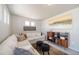 Inviting living room with neutral tones, modern décor, and ample natural light at 13518 E 103Rd Pl, Commerce City, CO 80022