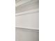 Neutral painted interior wall features a chair rail near the ceiling and base molding at 13518 E 103Rd Pl, Commerce City, CO 80022